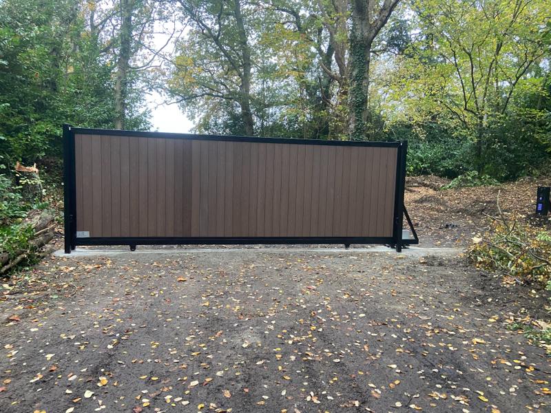Automated composite sliding gate installed by Portara Automation