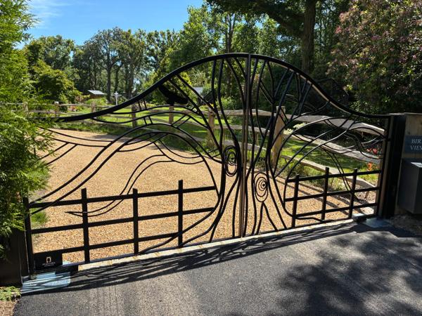 Bespoke decorative metal gate with an organic pattern, seen from another angle